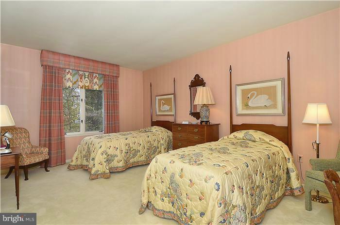 913 Poplar Hill Road Baltimore, MD 21210 - Photo 19 of 21 a bedroom with two beds and a window