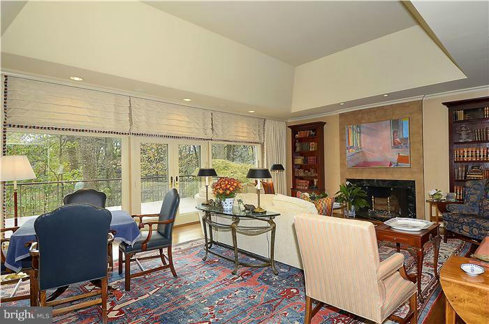 913 Poplar Hill Road Baltimore, MD 21210 - Photo 8 of 21 a living room with fireplace furniture and floor to ceiling windows