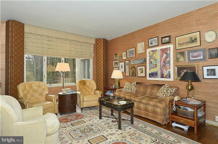 913 Poplar Hill Road Baltimore, MD 21210 - Photo 9 of 21 a living room with furniture a rug and a large window