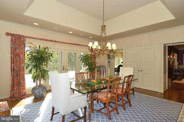 913 Poplar Hill Road Baltimore, MD 21210 - Photo 10 of 21 a view of a dining room with furniture wooden floor and chandelier