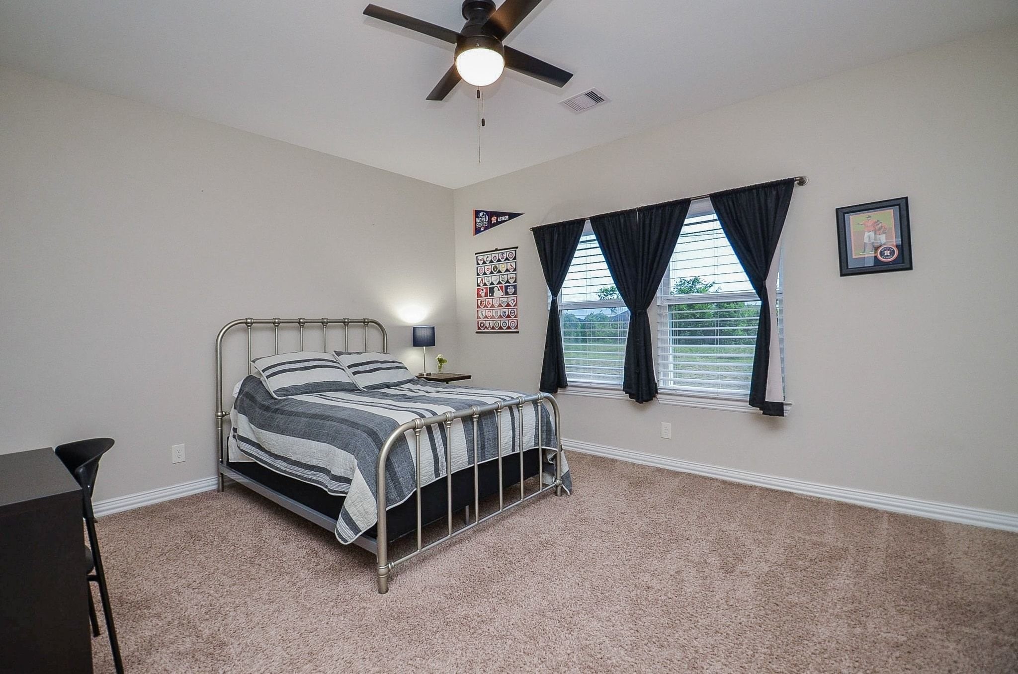 2714 Topaz Cove Lane Rosharon, TX 77583 - Photo 42 of 50 a bedroom with a bed and window