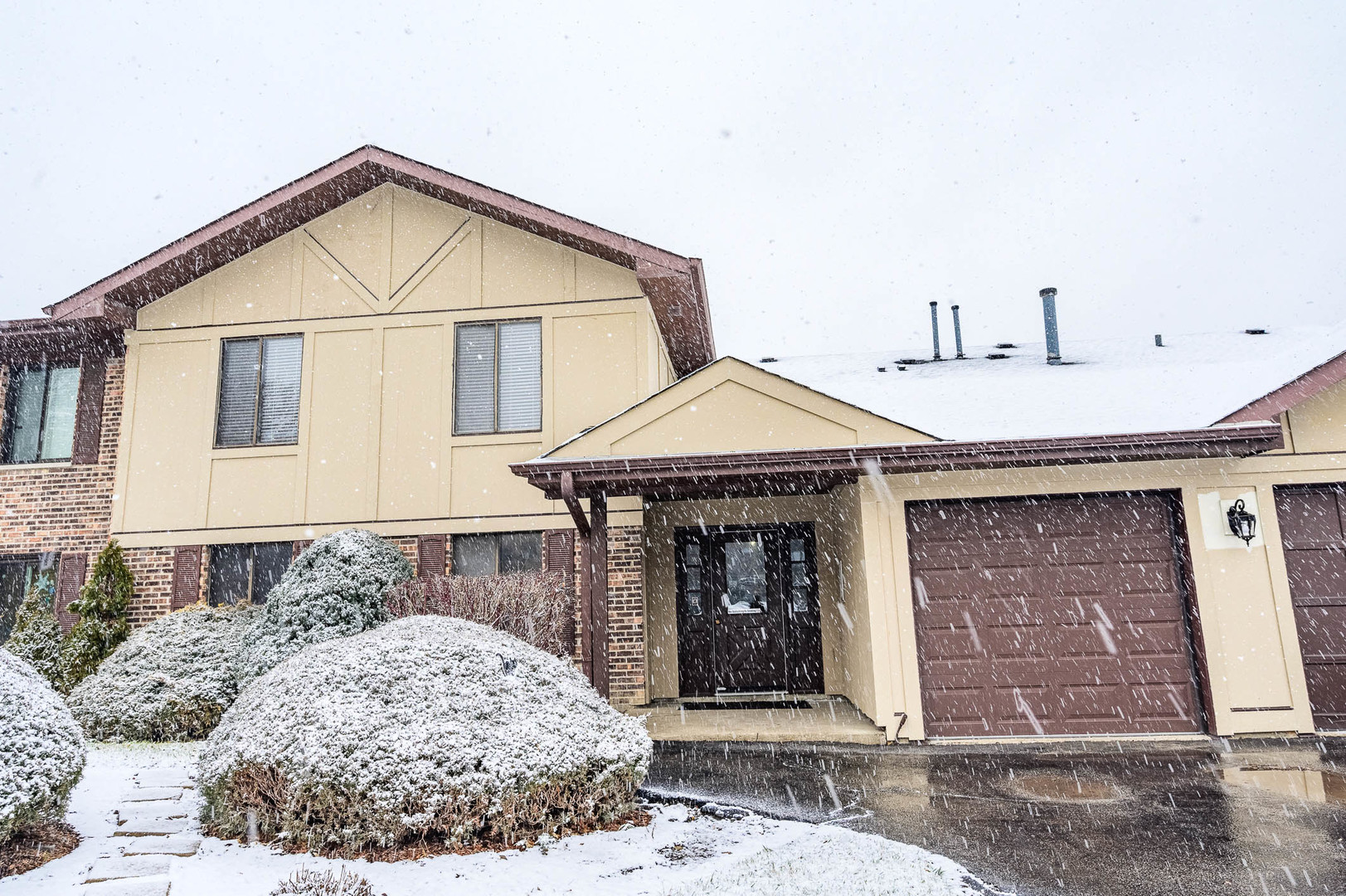 1452 North Elmhurst Road, Unit 103C Mount Prospect, IL 60056 - Photo 1 of 7 a view of a house with a outdoor space