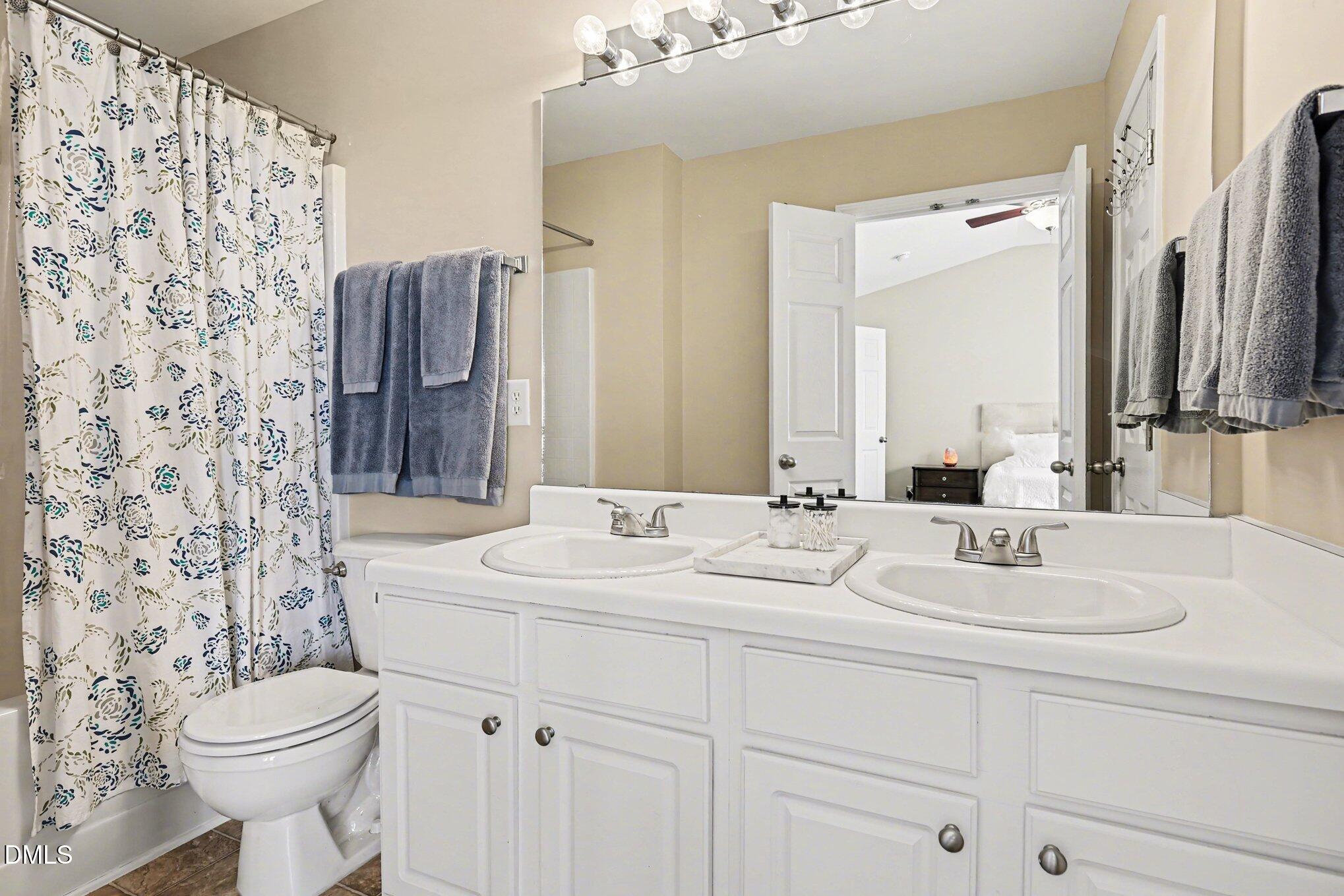 8211 Rhiannon Road Raleigh, NC 27613 - Photo 15 of 25 Primary Bath