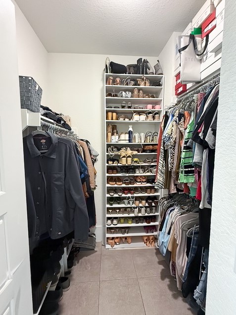 1805 Roseburg Drive, Unit 31 Austin, TX 78754 - Photo 10 of 19 a view of walk in closet with clothes and shoes