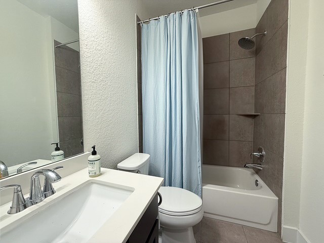 1805 Roseburg Drive, Unit 31 Austin, TX 78754 - Photo 13 of 19 a bathroom with a sink toilet and shower