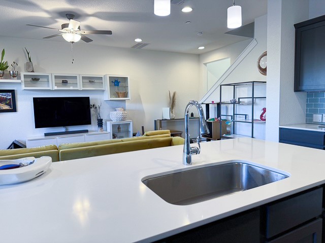 1805 Roseburg Drive, Unit 31 Austin, TX 78754 - Photo 18 of 19 a kitchen with a counter space a sink and cabinets
