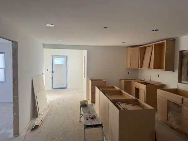 a kitchen that has a sink and a stove in it