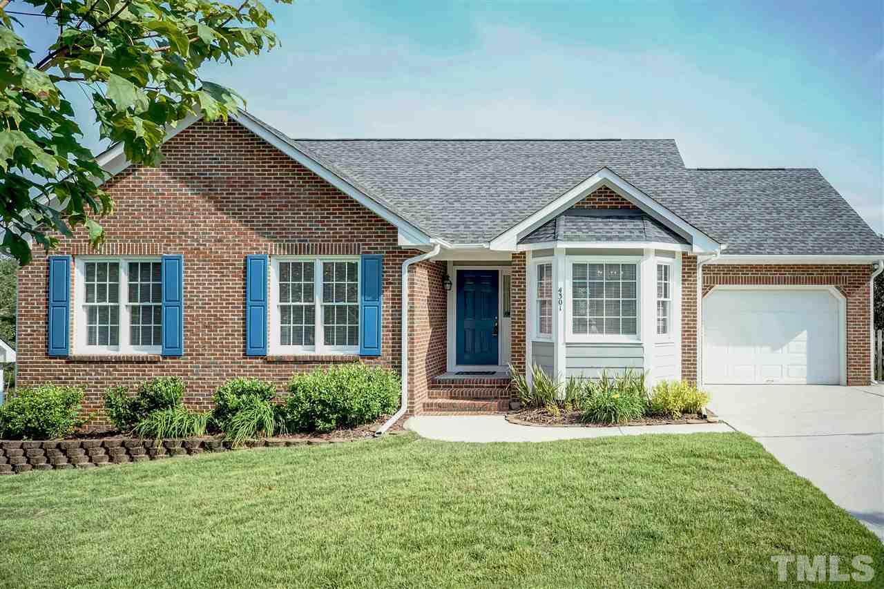 front view of a house and a yard