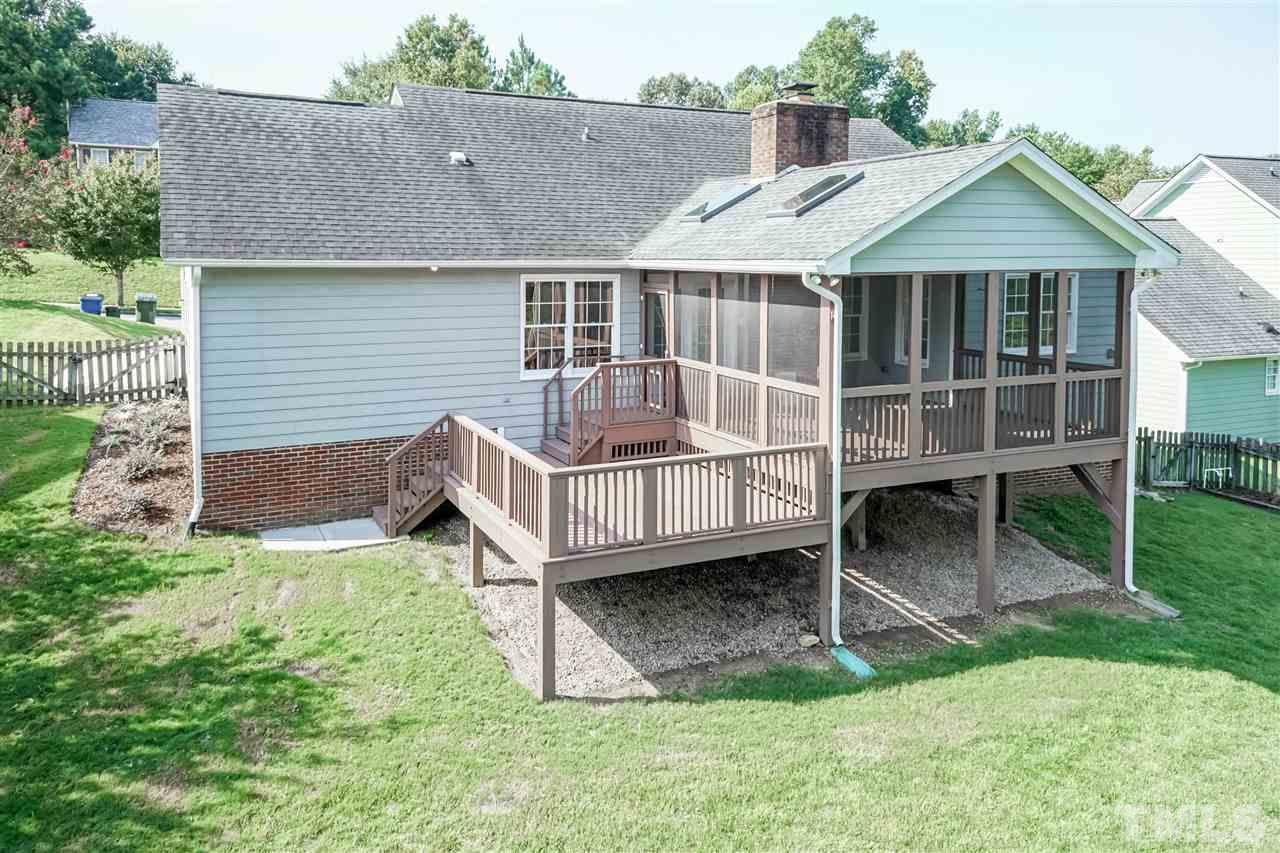 4301 Willow Lake Road Raleigh, NC 27616 - Photo 22 of 30 a view of a house with a yard and deck