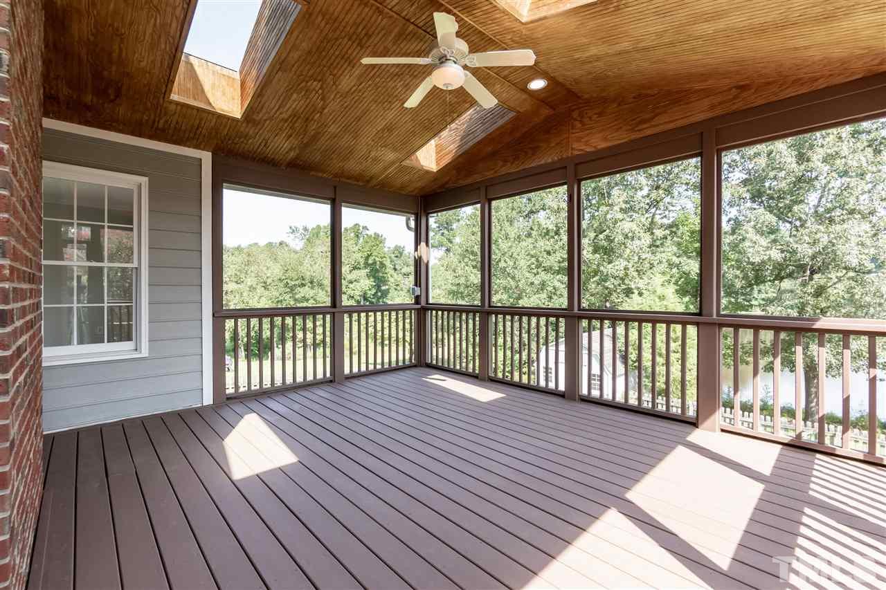 4301 Willow Lake Road Raleigh, NC 27616 - Photo 23 of 30 a view of a wooden deck with large windows