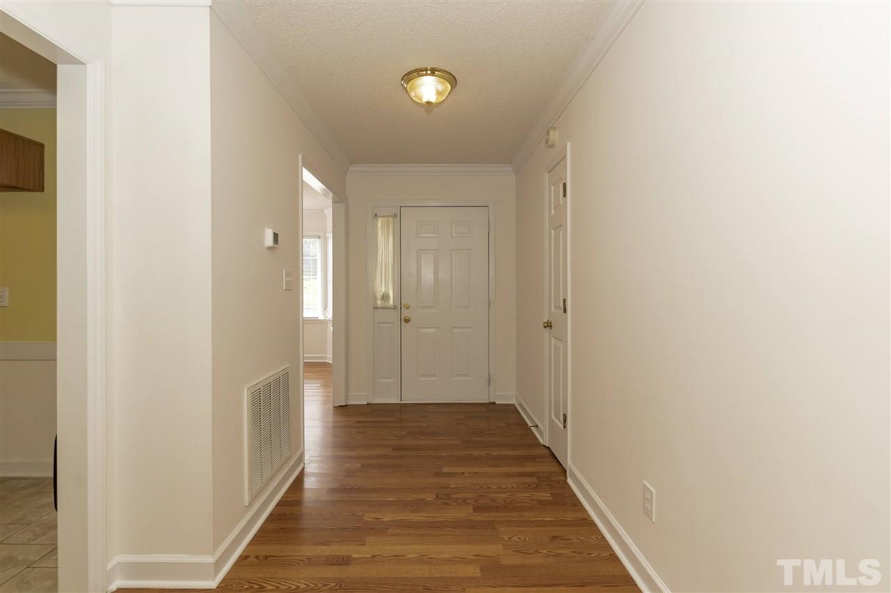 4301 Willow Lake Road Raleigh, NC 27616 - Photo 4 of 30 a view of a hallway with wooden floor