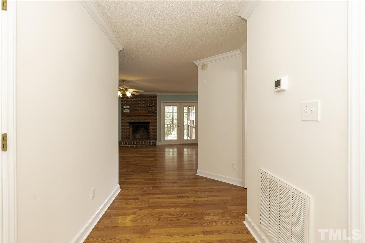 4301 Willow Lake Road Raleigh, NC 27616 - Photo 5 of 30 a view of a hallway view with wooden floor and staircase