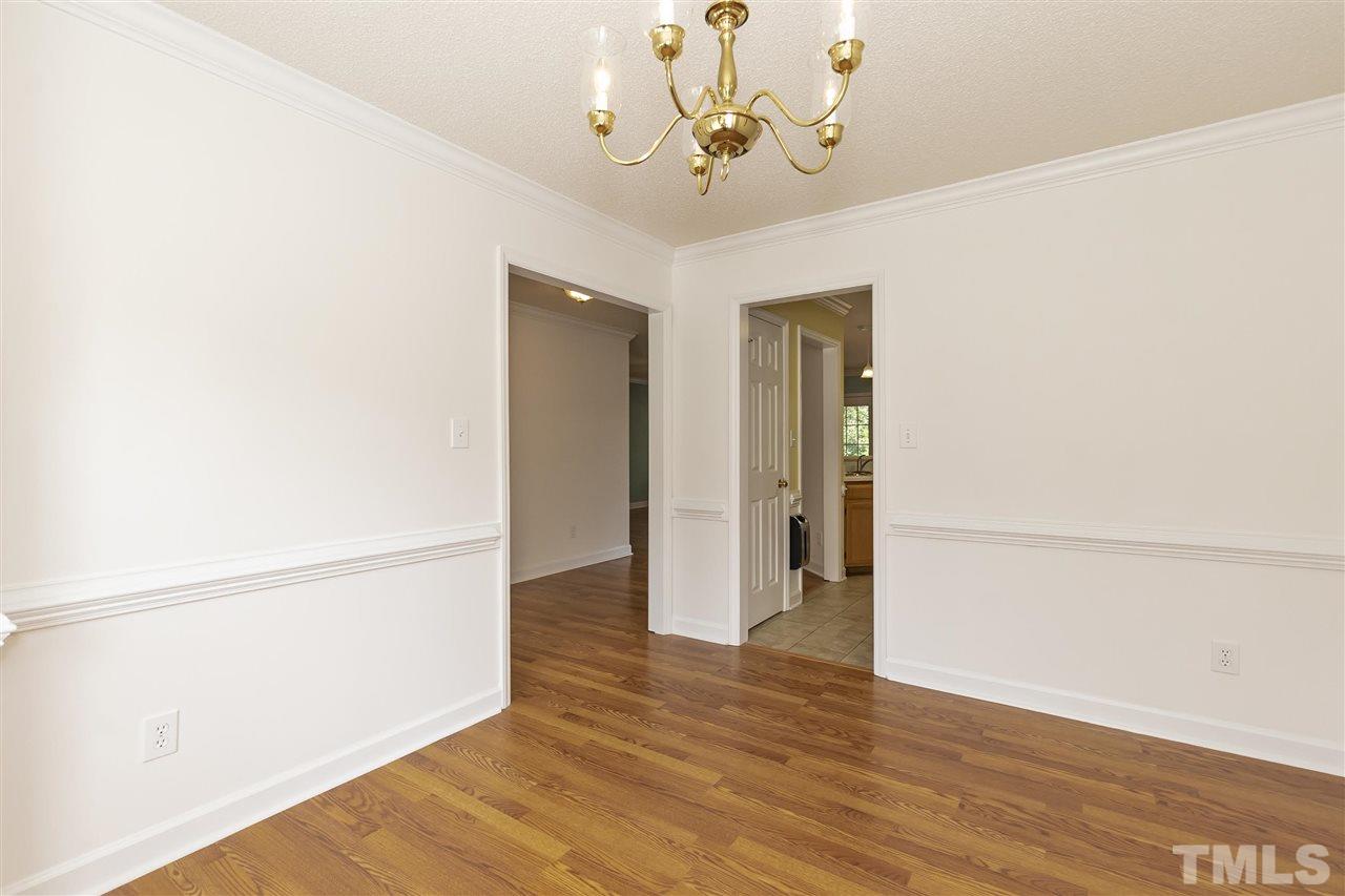 4301 Willow Lake Road Raleigh, NC 27616 - Photo 7 of 30 a view of a hallway with wooden floor
