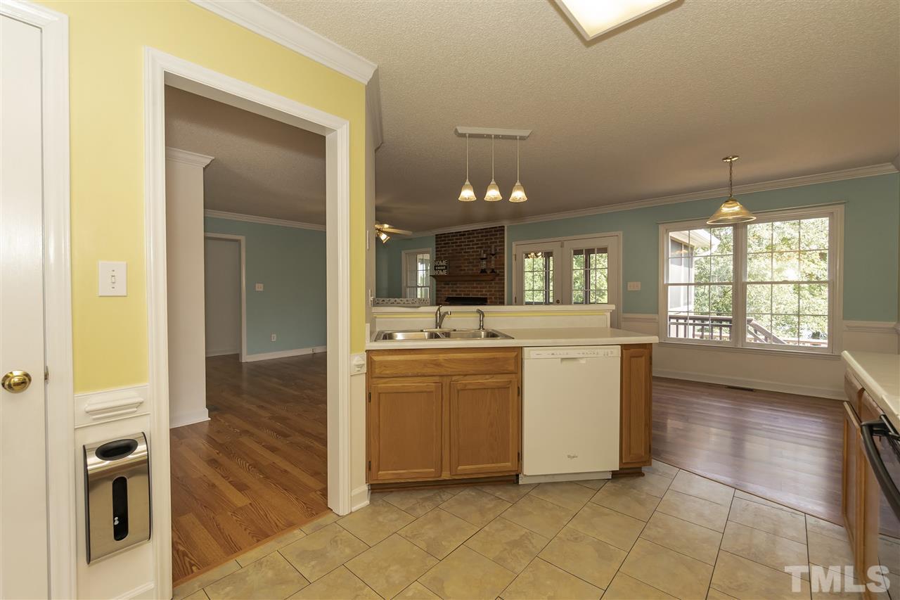 4301 Willow Lake Road Raleigh, NC 27616 - Photo 9 of 30 a kitchen with a refrigerator and a stove