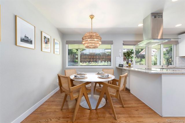 a view of a dining room with furniture window and wooden floor