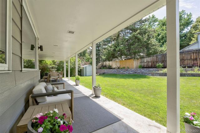 a view of a patio with couches table and chairs
