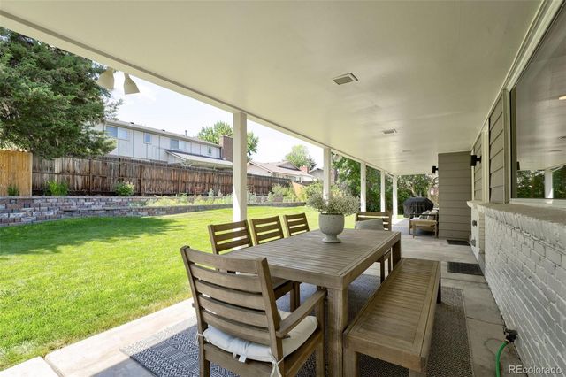 a house with swimming pool in front of it