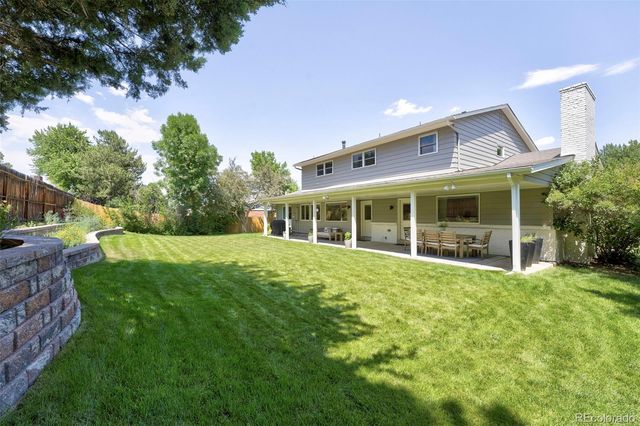 a view of a backyard with a garden and plants
