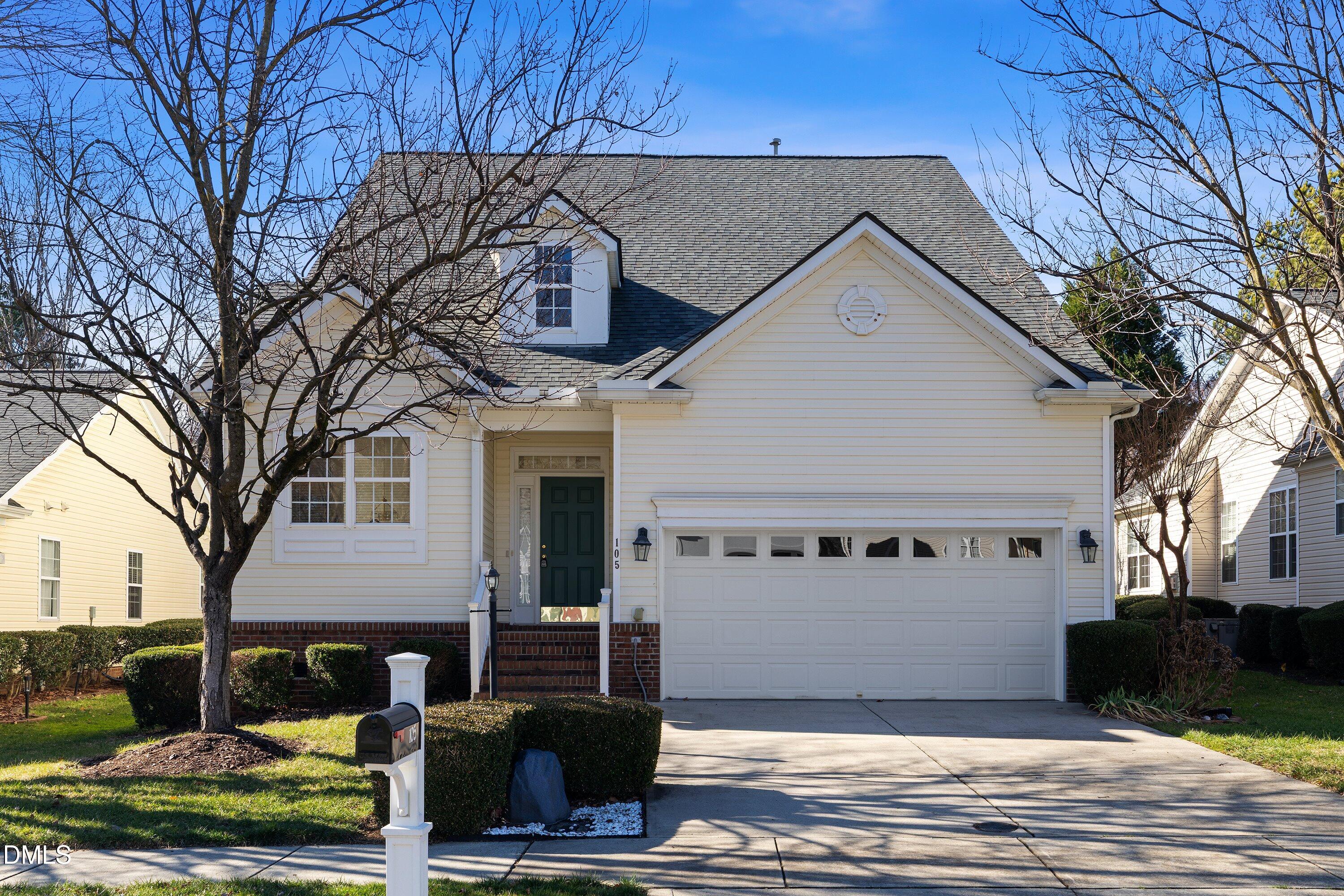 105 Rockport Ridge Way Cary, NC 27519 - Photo 41 of 43 a view of a white house with a large tree