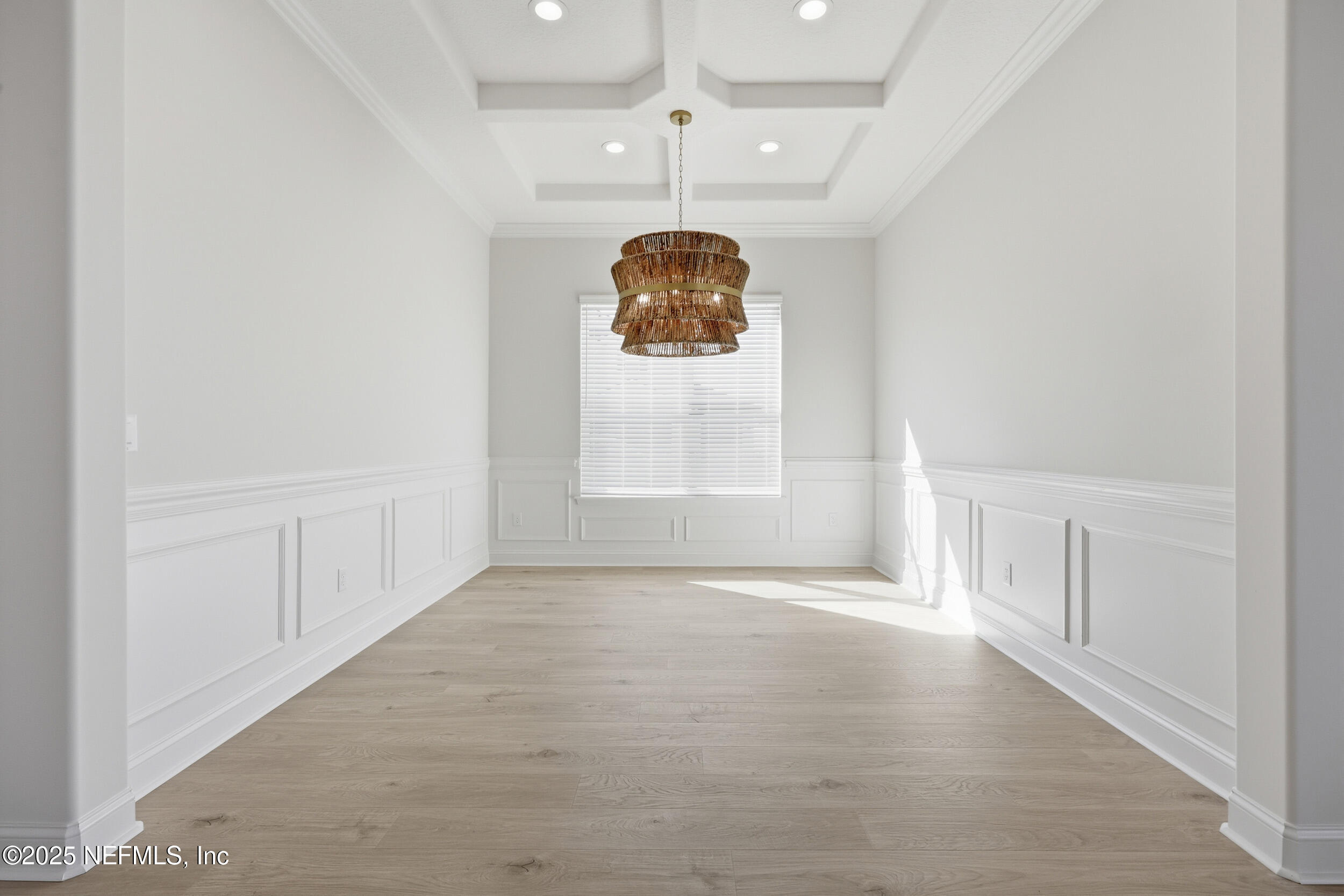 23 Owl Lndg Way St. Augustine, FL 32092 - Photo 11 of 19 an empty room with windows and chandelier