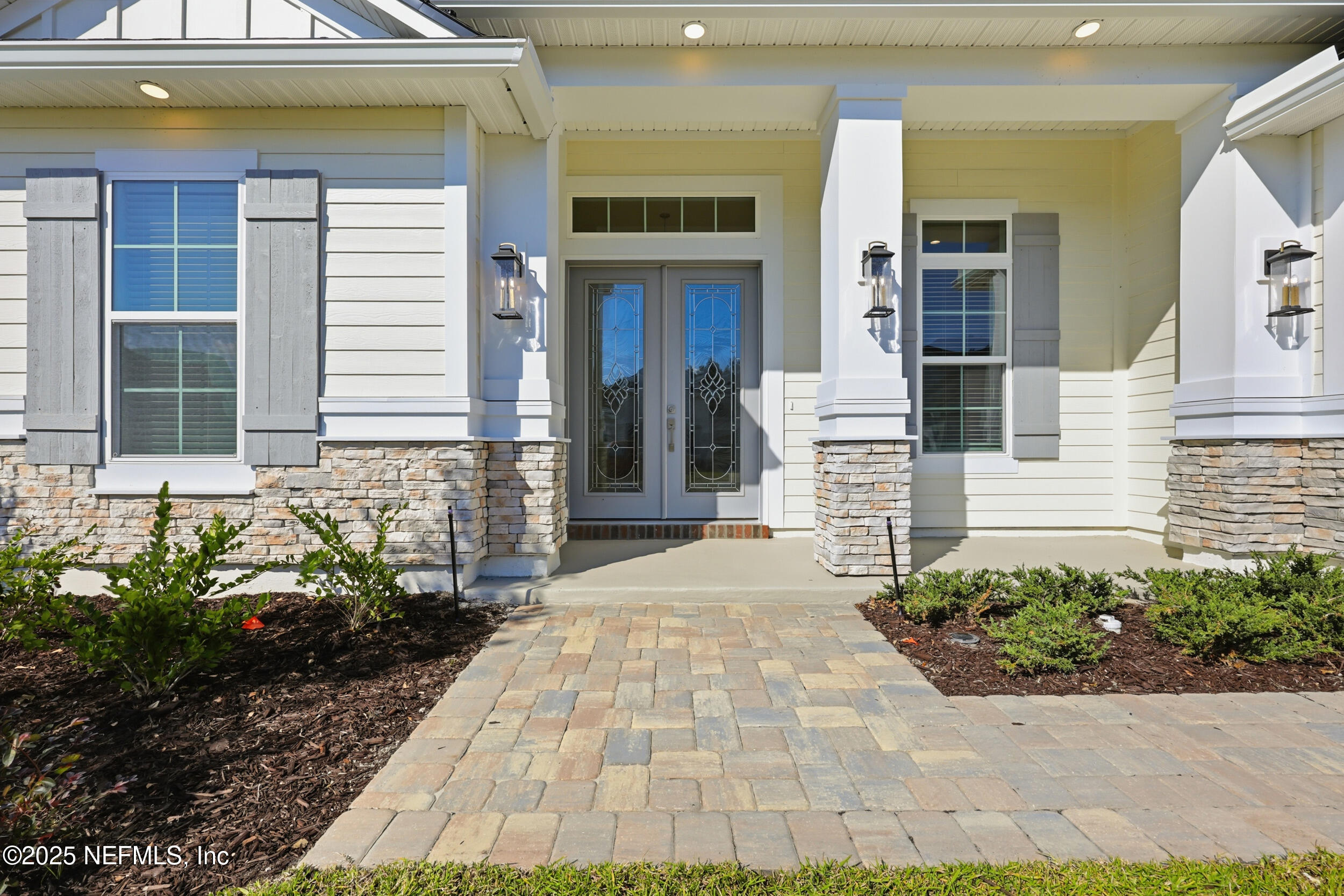 23 Owl Lndg Way St. Augustine, FL 32092 - Photo 2 of 19 a view of a brick house with potted plants