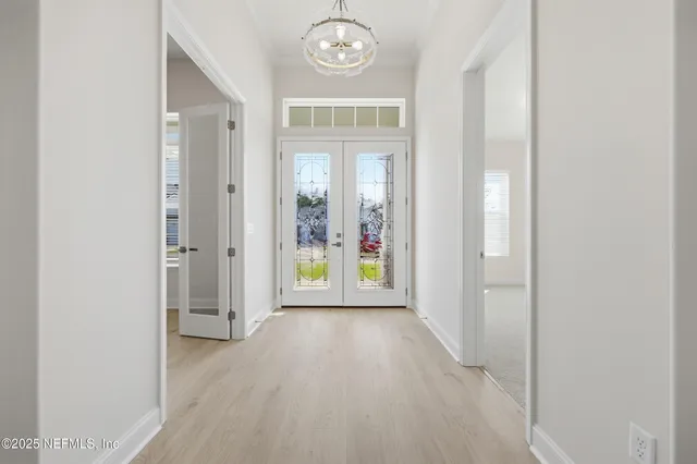 a view of an entryway with wooden floor