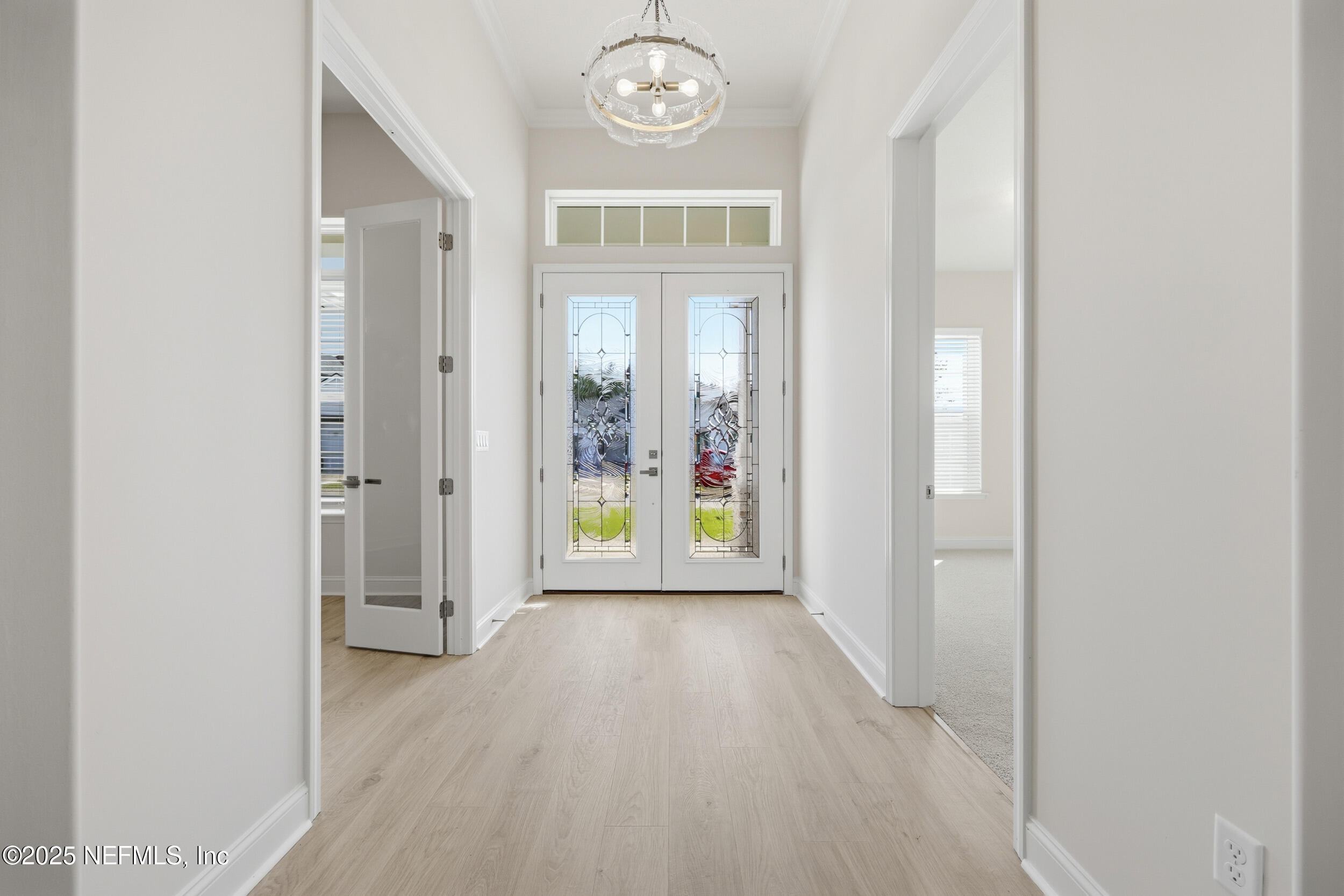 23 Owl Lndg Way St. Augustine, FL 32092 - Photo 4 of 19 a view of an entryway with wooden floor