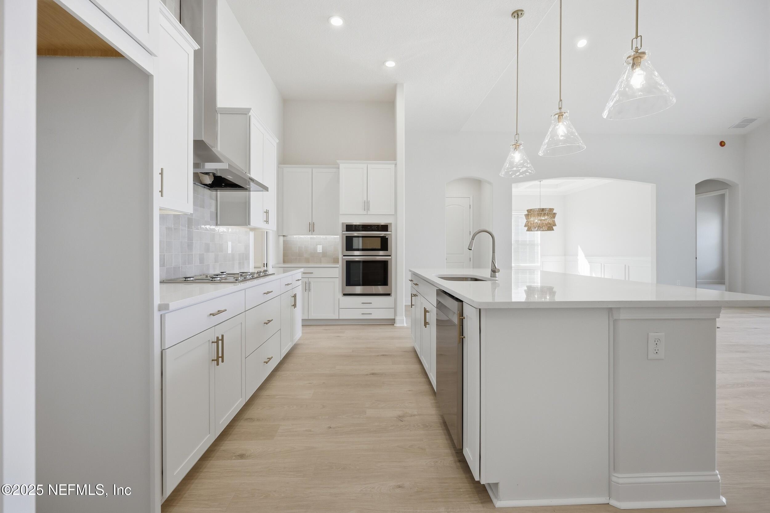 23 Owl Lndg Way St. Augustine, FL 32092 - Photo 9 of 19 a large kitchen with granite countertop a large counter top appliances and cabinets