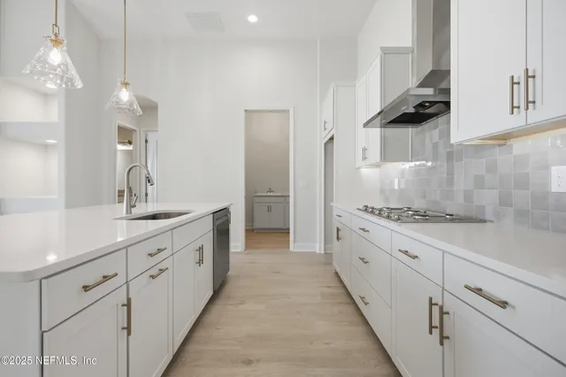 a large kitchen with cabinets