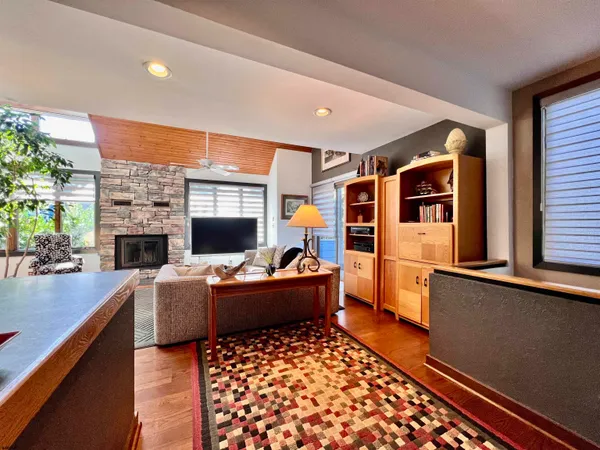 a kitchen with stainless steel appliances granite countertop a refrigerator a stove top oven a sink and dishwasher