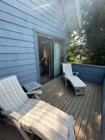 a backyard of a house with outdoor seating