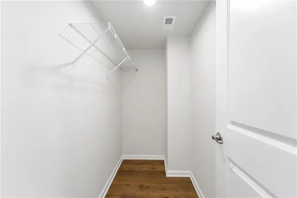 a view of a room with white walls