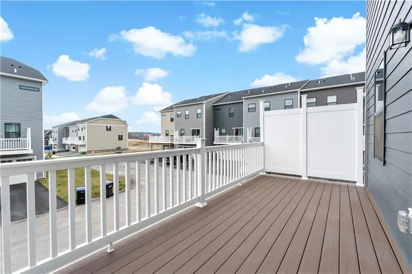 a view of a balcony with wooden floor