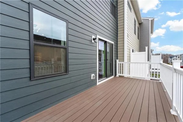 a view of backyard with wooden deck