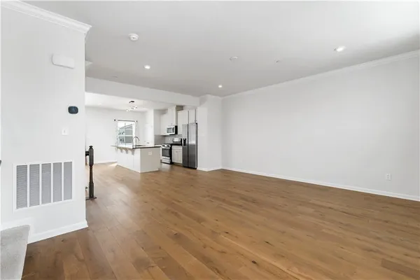 a view of kitchen and wooden floor