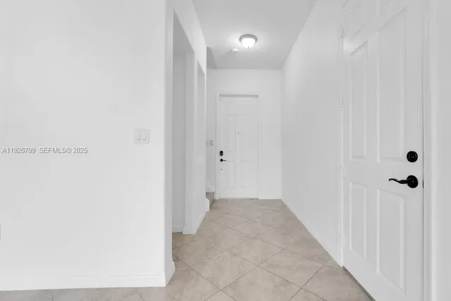 a white toilet sitting next to a shower