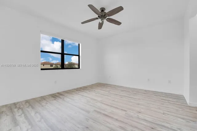 a view of room with wooden floor