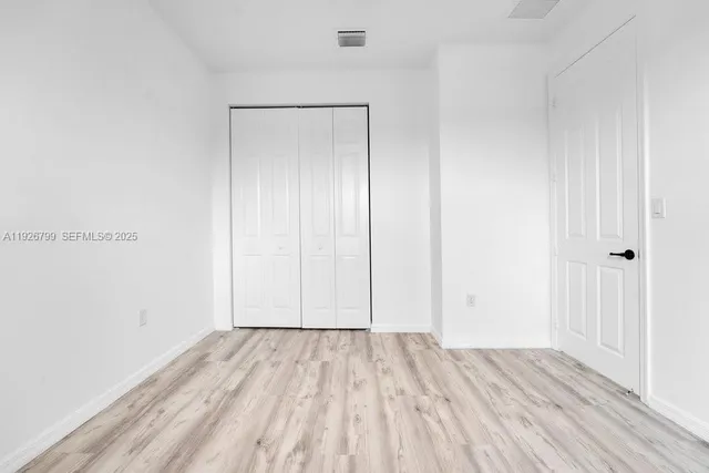 a bathroom with a granite countertop sink mirror and double
