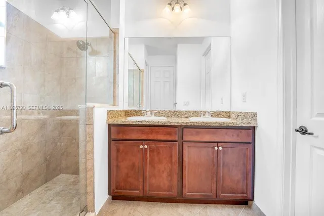 a view of room with stairs and wooden floor