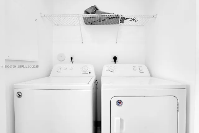 a view of a lake with houses in the back