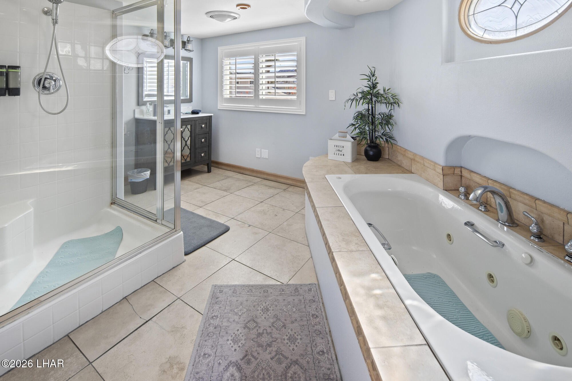 7870 Riverside Drive Parker, AZ 85344 - Photo 22 of 88 a spacious bathroom with a tub a double vanity sink a mirror and shower