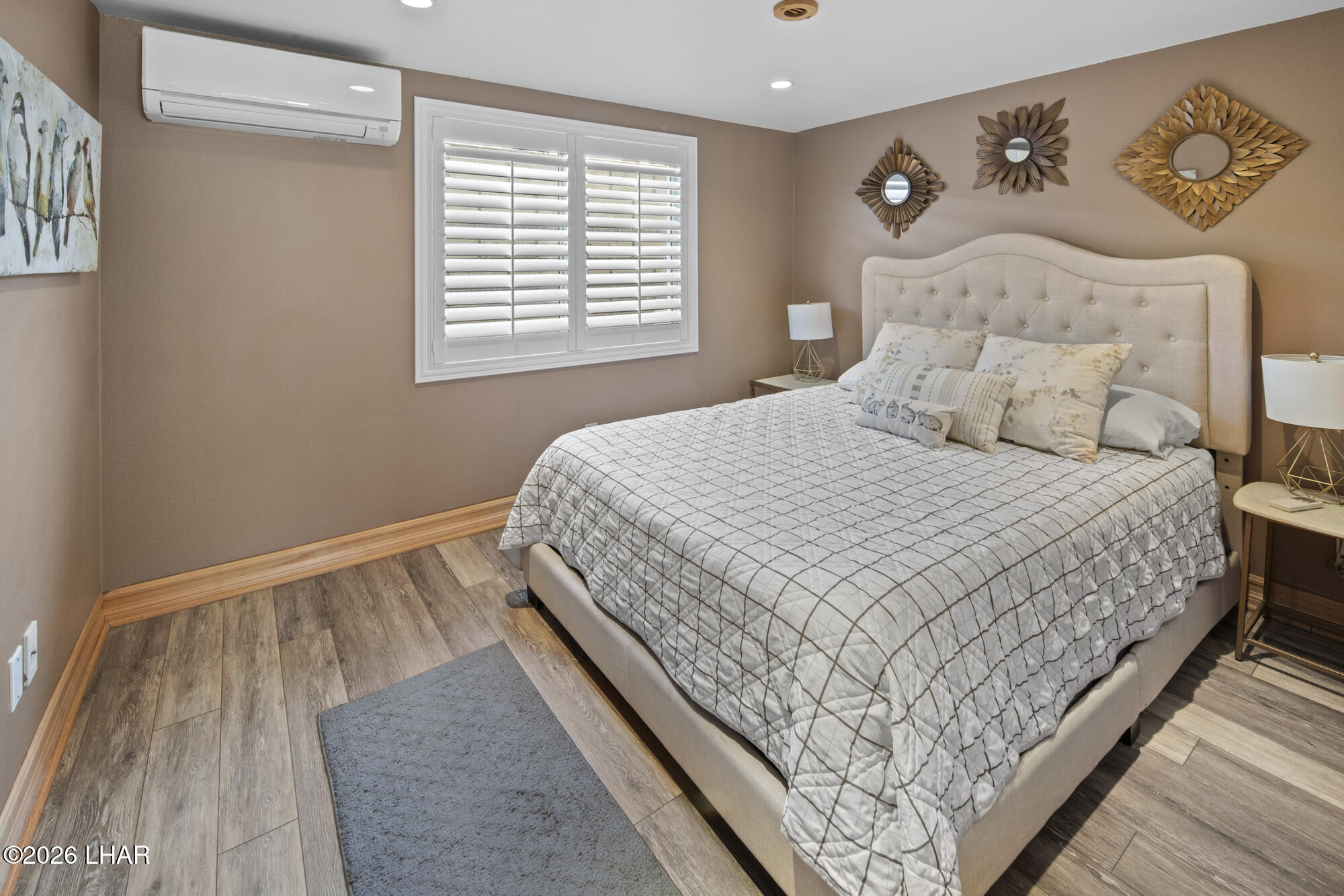 7870 Riverside Drive Parker, AZ 85344 - Photo 23 of 88 a large bed sitting in a bedroom next to a window