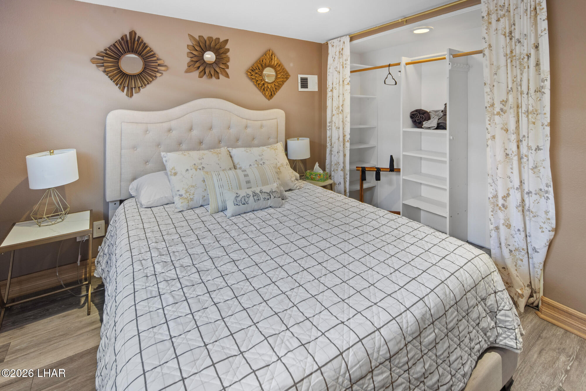 7870 Riverside Drive Parker, AZ 85344 - Photo 24 of 88 a bedroom with a bed and a painting on the wall