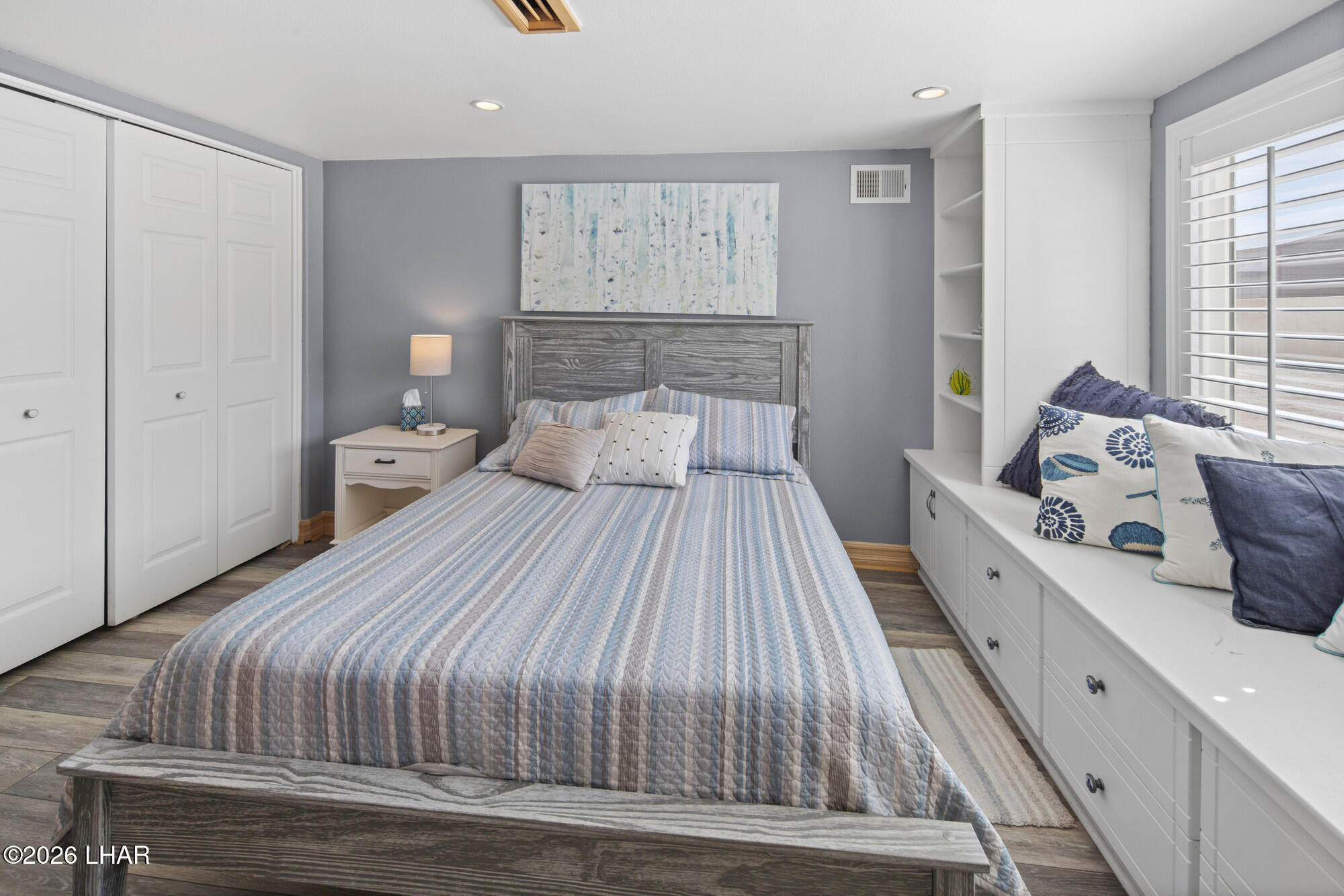 7870 Riverside Drive Parker, AZ 85344 - Photo 26 of 88 a bedroom with a bed and wooden floor