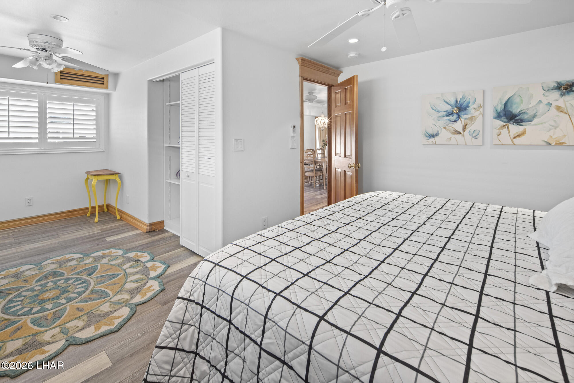 7870 Riverside Drive Parker, AZ 85344 - Photo 40 of 88 a bedroom with a bed and painting on the wall