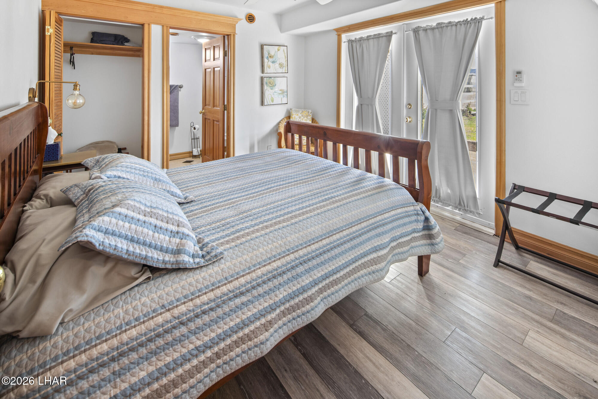 7870 Riverside Drive Parker, AZ 85344 - Photo 43 of 88 a bedroom with a bed and wooden floor