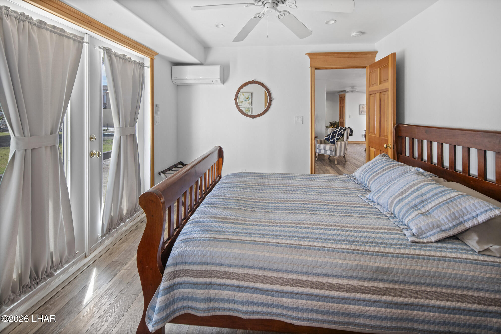 7870 Riverside Drive Parker, AZ 85344 - Photo 44 of 88 a view of a bedroom with wooden floor and stairs