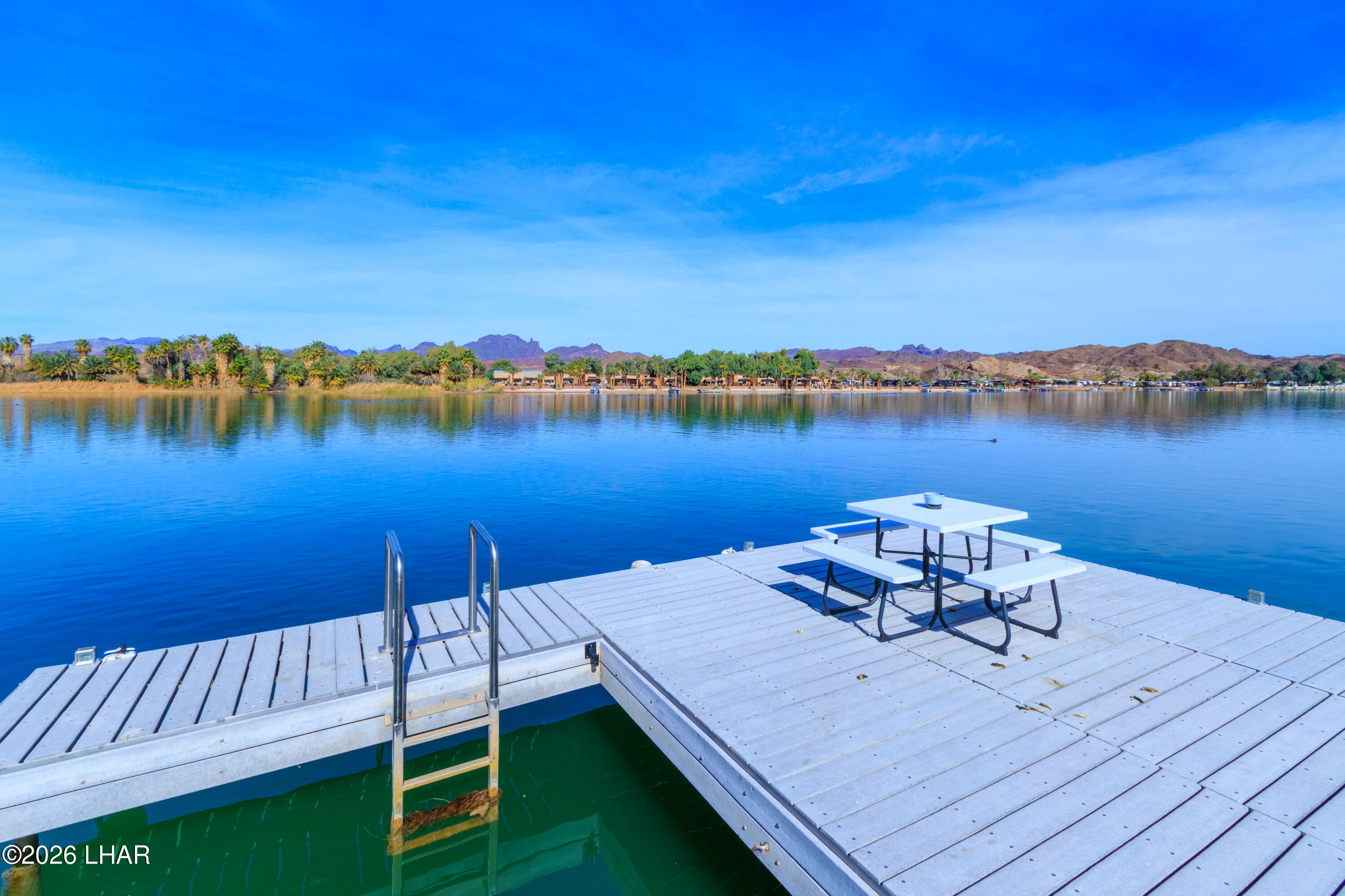 7870 Riverside Drive Parker, AZ 85344 - Photo 5 of 88 a view of a roof deck with lake and mountain view