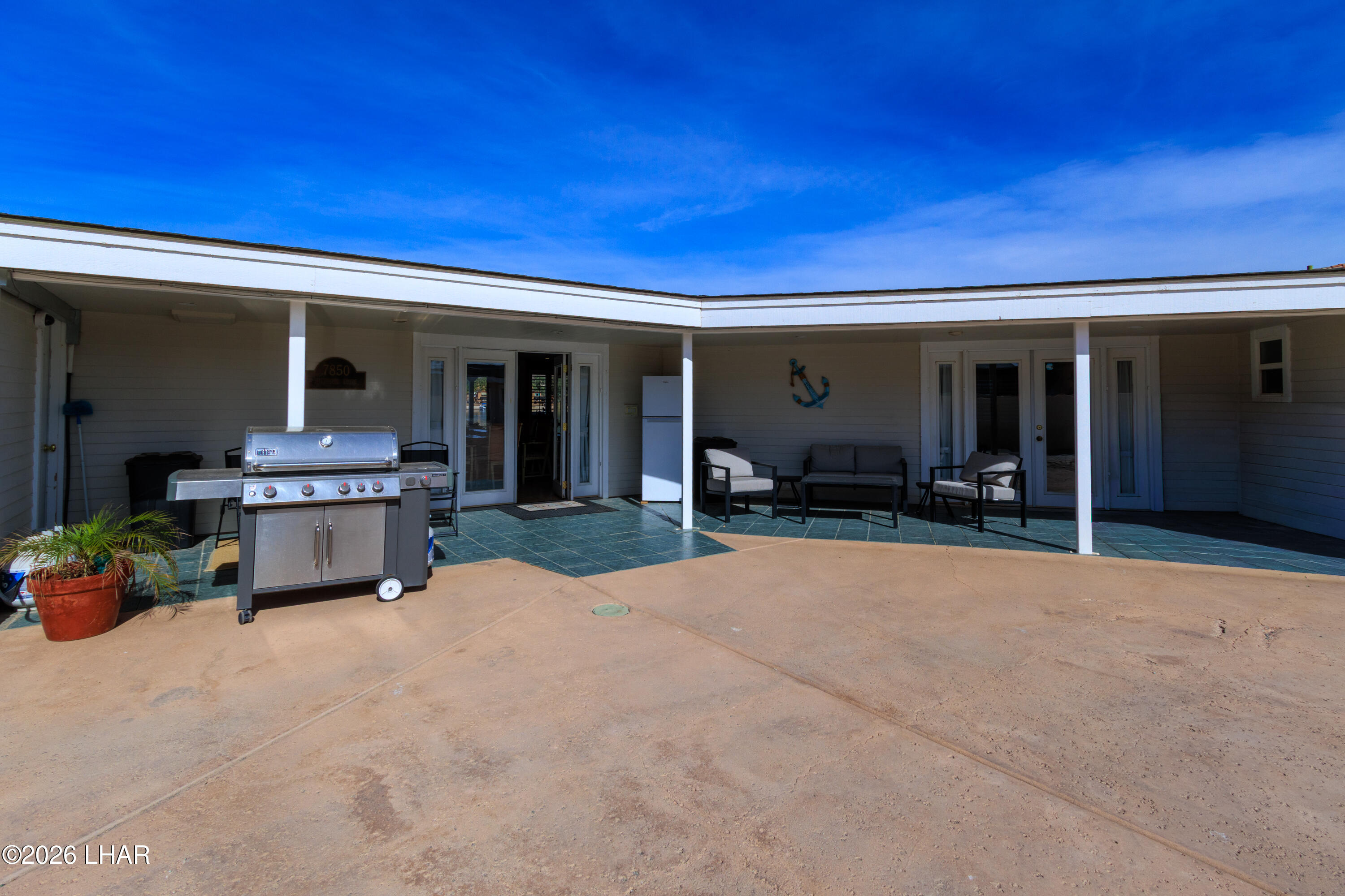 7870 Riverside Drive Parker, AZ 85344 - Photo 56 of 88 a bedroom with furniture and a potted plant