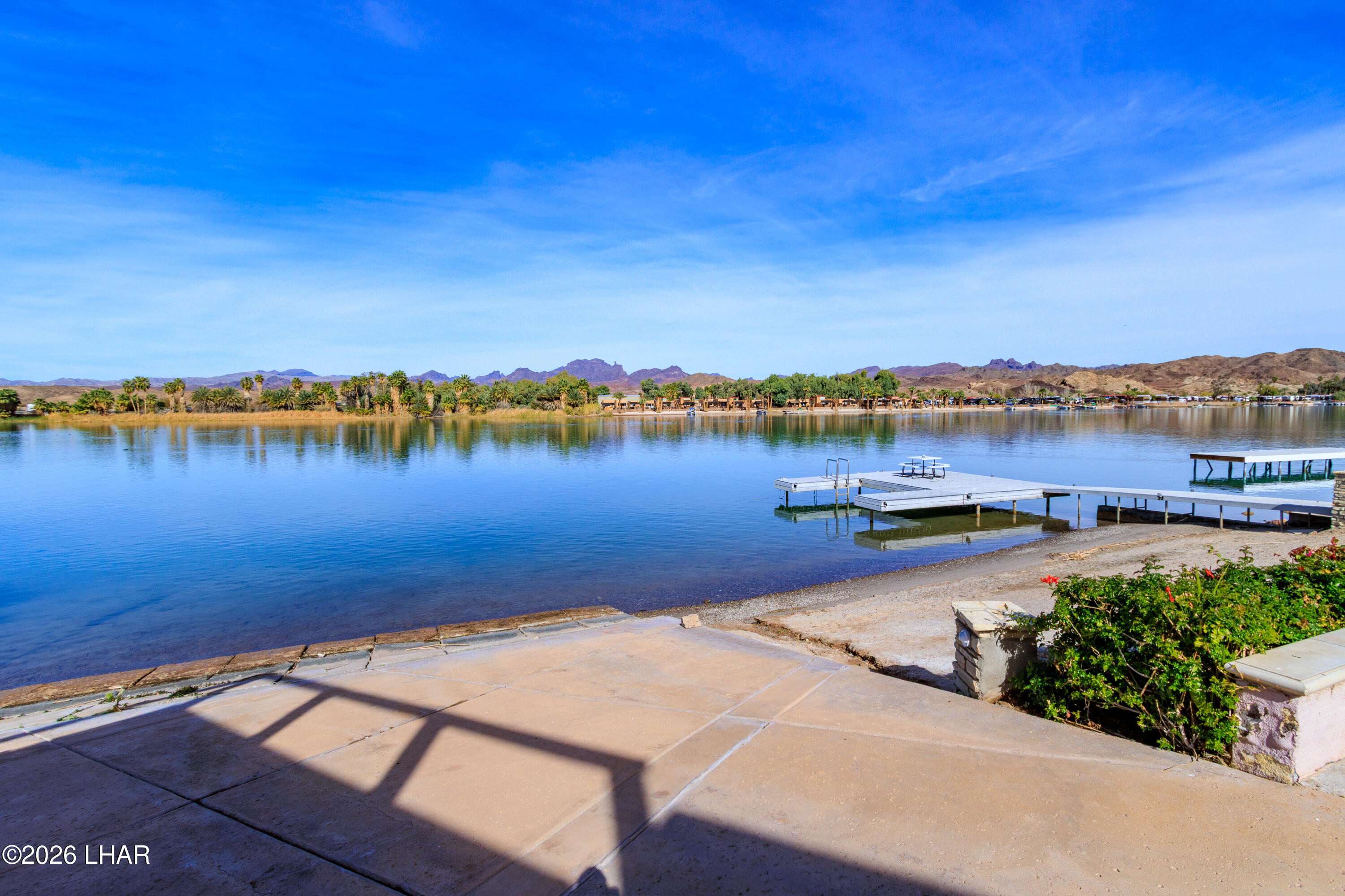 7870 Riverside Drive Parker, AZ 85344 - Photo 59 of 88 a view of a lake with houses in the back